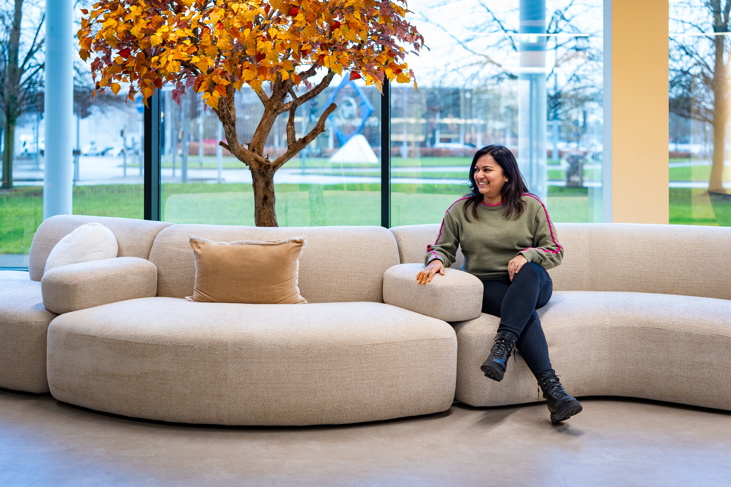 Breakout lounge area with autumnal foliage, corporate interior shoot