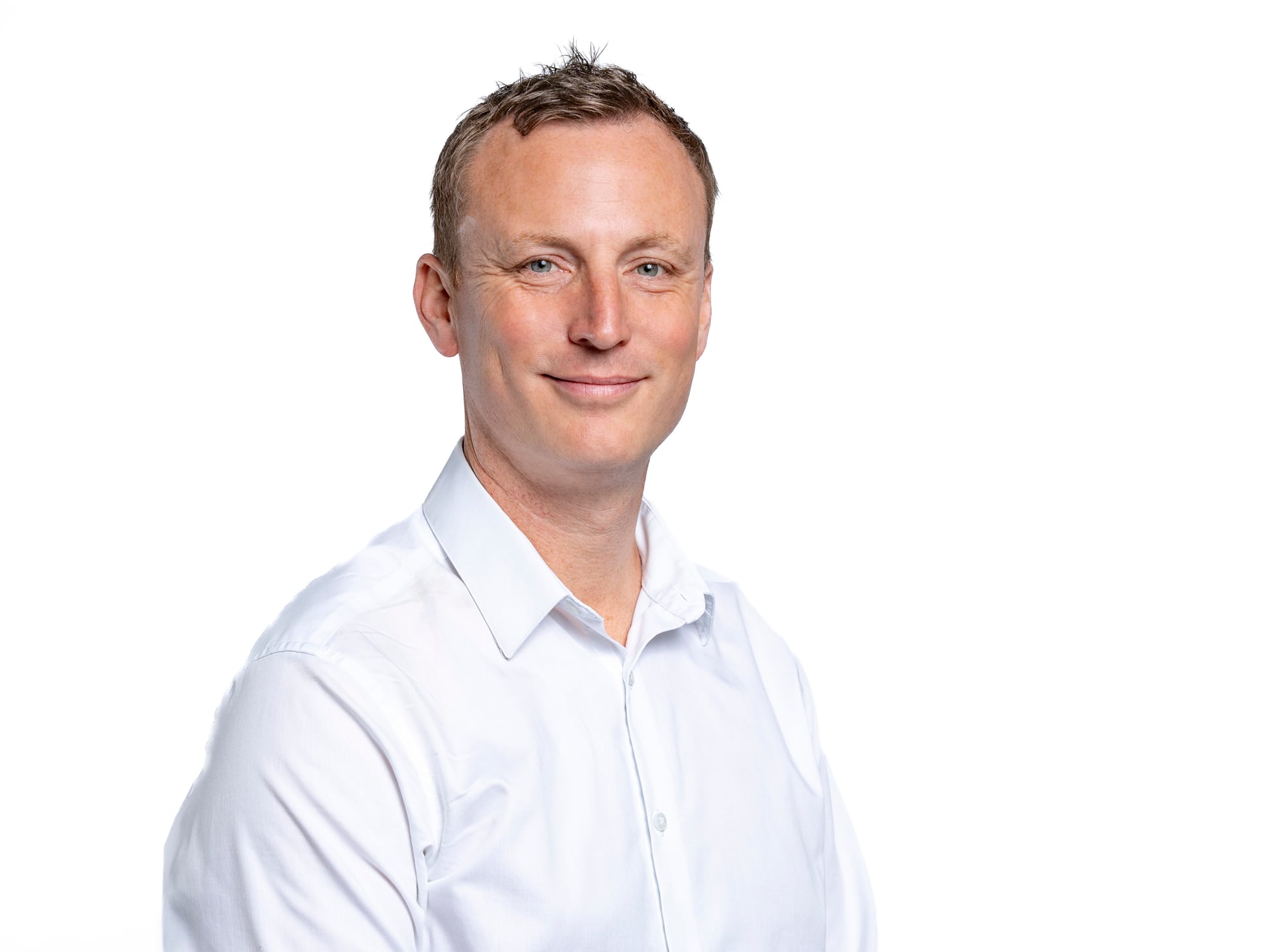 Corporate headshot — clean, natural professional portrait